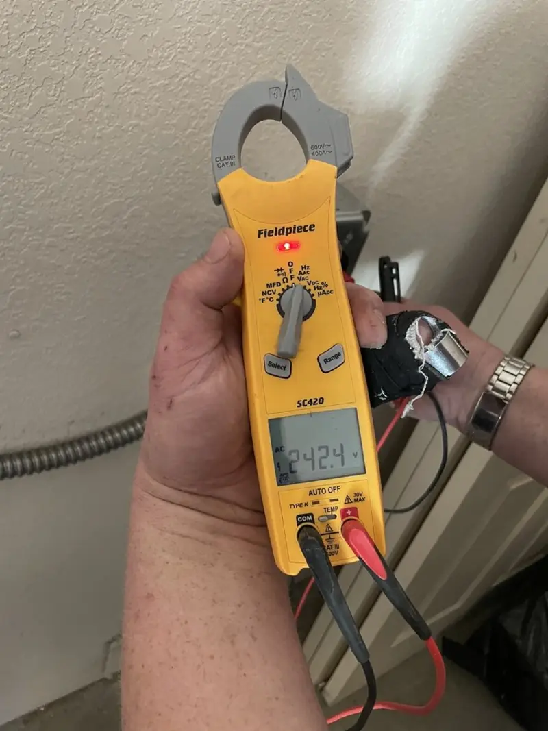 Voltage testing with clamp meter during Electrical Installation Services in Inverness Highlands South